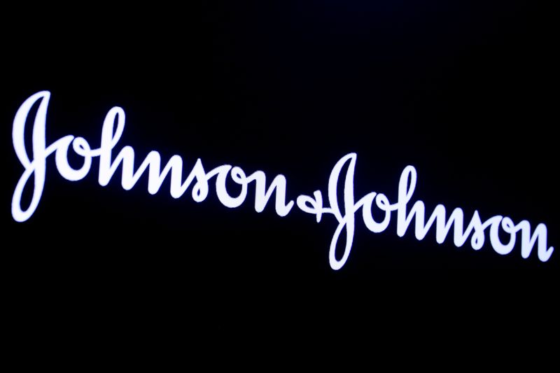 FILE PHOTO: The company logo for Johnson & Johnson is displayed on a screen to celebrate the 75th anniversary of the company's listing at the NYSE in New York