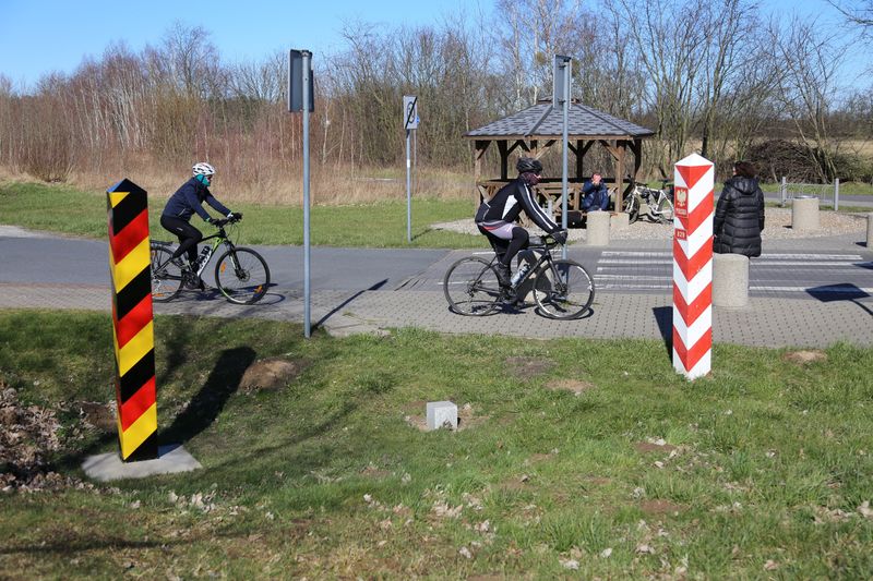 People bike at the local border crossibg between Poland and Germany in Buk - Blankensee