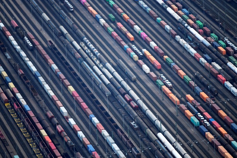 Containers are loaded on freight trains at the railroad shunting yard in Maschen near Hamburg