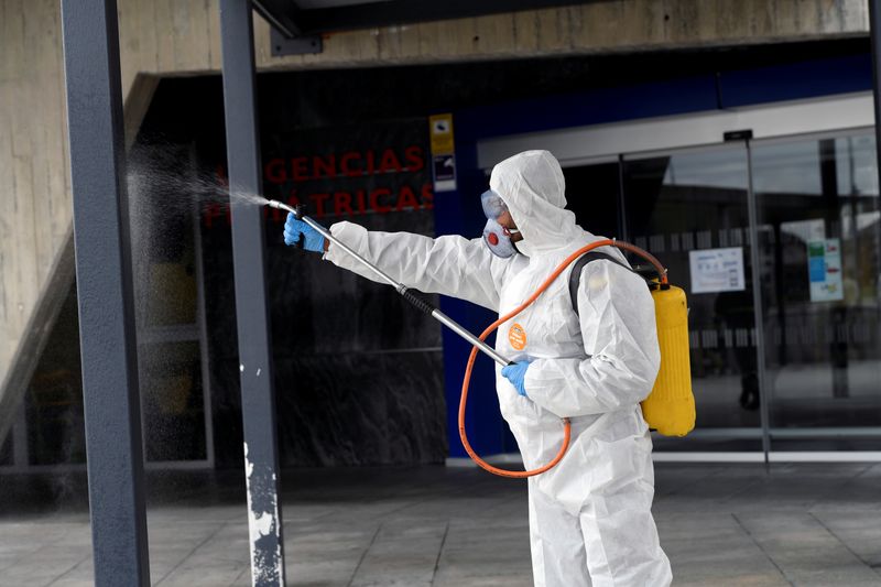 A member of the Military Emergency Unit (UME) disinfects the HUCA (Central University Hospital of Asturias) during a 15-day state of emergency declared to combat the outbreak of the coronavirus disease in Oviedo