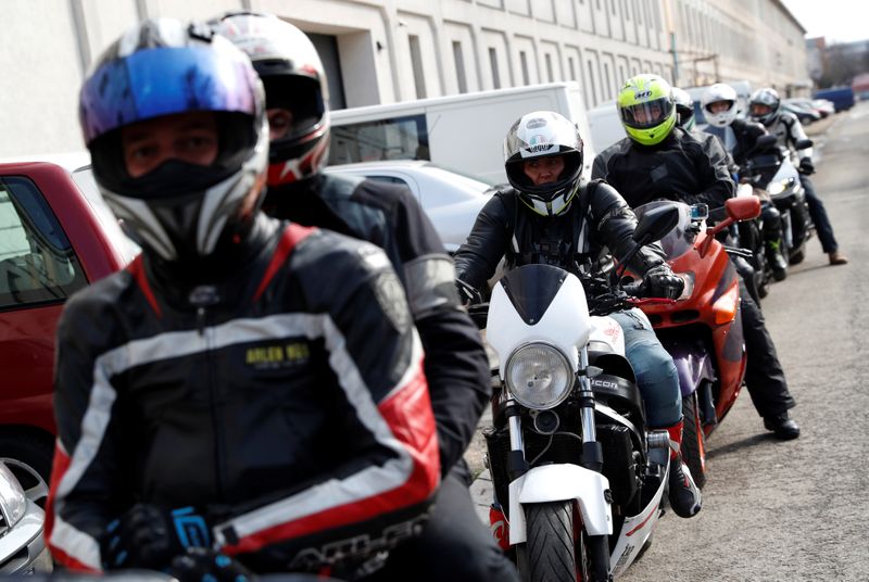Members of the 'Easy Riders', a Hungarian bikers group, gather to help a domestic violence victim in Budapest