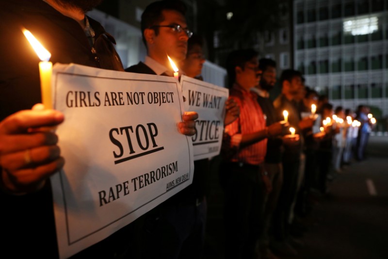 FILE PHOTO: Resident doctors and medical students from AIIMS attend a candle-lit march to protest against the alleged rape and murder of a 27-year-old woman on the outskirts of Hyderabad, in New Delhi