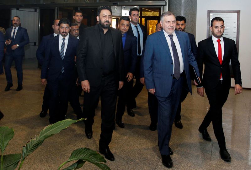Iraqi Prime Minister Mohammed Tawfiq Allawi arrives at the parliament headquarters in Baghdad