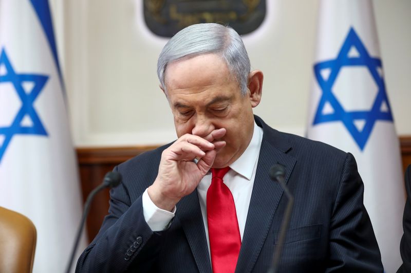 Israeli Prime Minister Benjamin Netanyahu gestures as he chairs the weekly cabinet meeting in Jerusalem