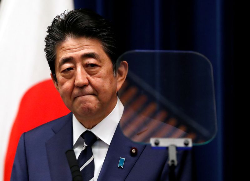 FILE PHOTO: Japan's Prime Minister Shinzo Abe attends a news conference on coronavirus at his official residence in Tokyo