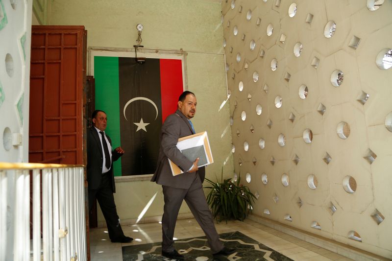 A worker walks inside the embassy of Libya's eastern-based government led by military commander Khalifa Haftar, that opened in Damascus