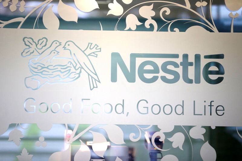 FILE PHOTO: Nestle logo is pictured on the door of the supermarket of Nestle headquarters in Vevey