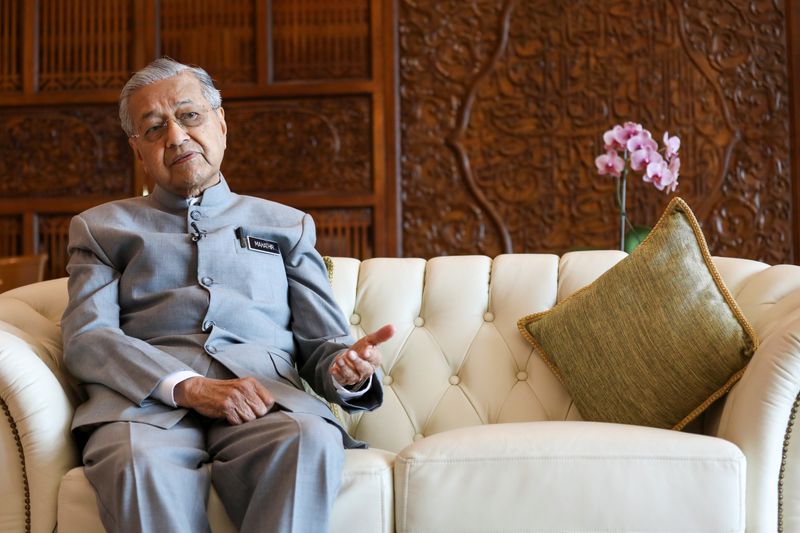 FILE PHOTO: Malaysia's Prime Minister Mahathir Mohamad speaks during an interview with Reuters in Putrajaya