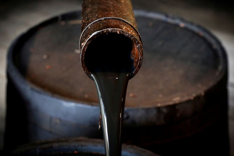 FILE PHOTO: Oil pours out of a spout from Edwin Drake's original 1859 well that launched the modern petroleum industry