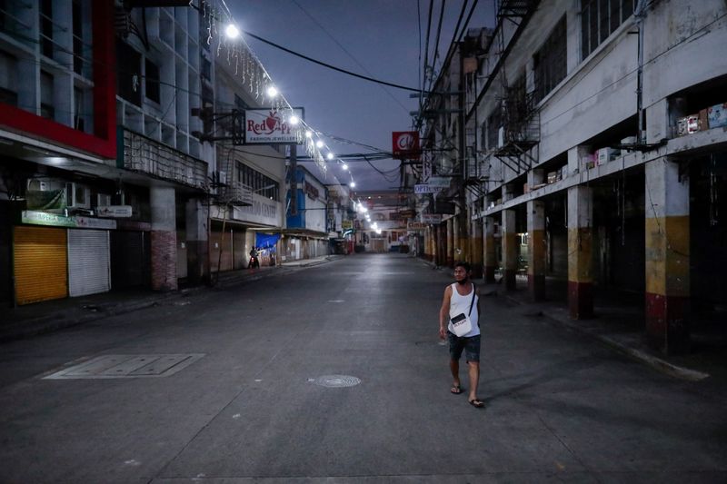FILE PHOTO: Empty streets are seen as the lockdown continues to contain the coronavirus disease (COVID-19) in Manila