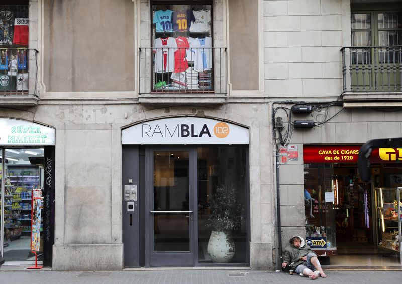 A homeless man asks for alms at Las Ramblas, during the coronavirus disease (COVID-19) outbreak, in Barcelona