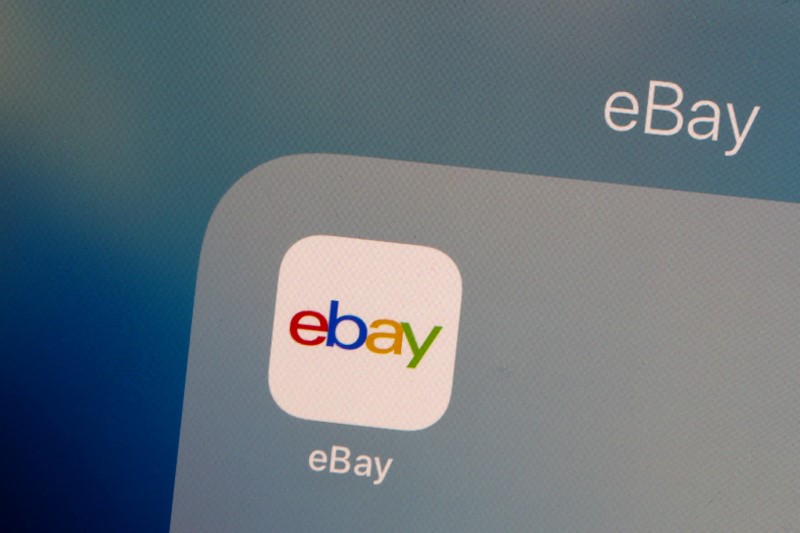 The eBay logo is pictured on a phone screen in this photo illustration in New York