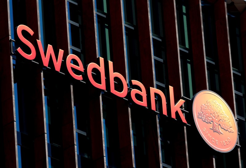 FILE PHOTO: A Swedbank sign on the Swedish bank's Lithuanian headquarters in Vilnius
