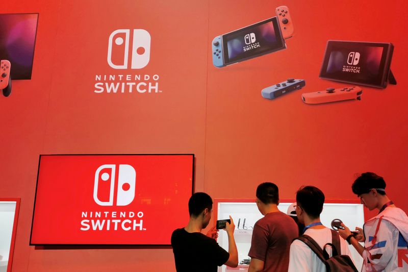 FILE PHOTO: Visitors are seen at a booth of Nintendo Switch at the China Digital Entertainment Expo and Conference in Shanghai