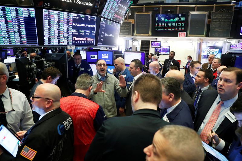 Traders work on the floor of the New York Stock Exchange shortly after the closing bell in New York