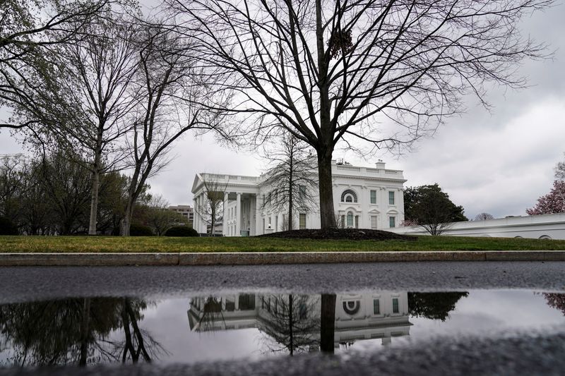 Clouds pass over the White House following the outbreak of coronavirus (COVID-19) in Washington
