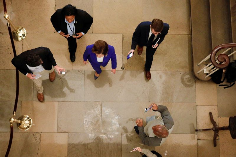 House Speaker Pelosi speaks to news reporters ahead of a vote on relief for the coronavirus (COVID-19) disease on Capitol Hill in Washington