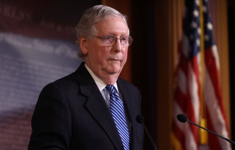 FILE PHOTO: Senate Majority Leader McConnell speaks to reporters after the Senate voted to acquit U.S. President Trump impeachment trial on Capitol Hill in Washington