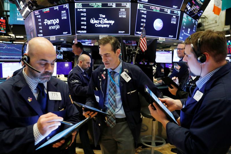 Traders work on the floor of the New York Stock Exchange (NYSE) in New York City, New York