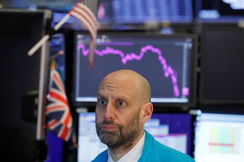 A trader works on the floor of the New York Stock Exchange (NYSE) in New York City, New York