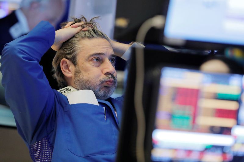 A trader works on the floor at the New York Stock Exchange (NYSE) in New York City