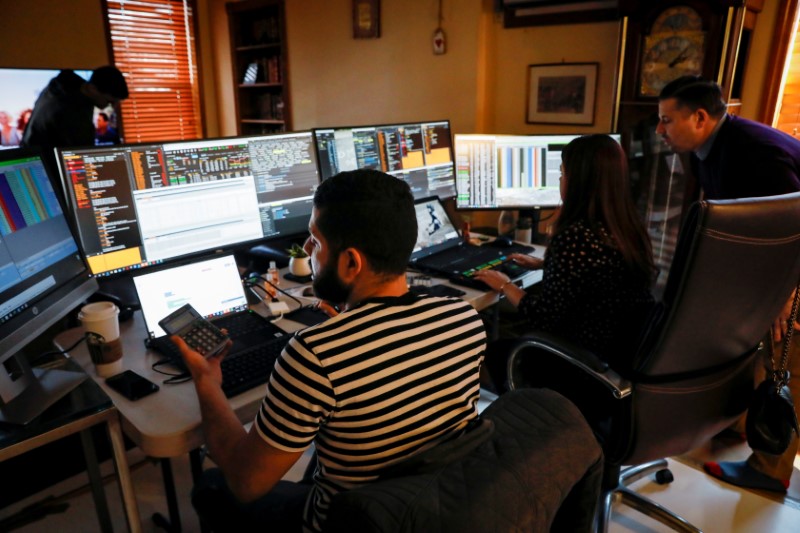 NYSE-AMEX Options floor traders from TradeMas Inc. work in an off-site trading office due to the outbreak of the coronavirus disease (COVID-19), in New York