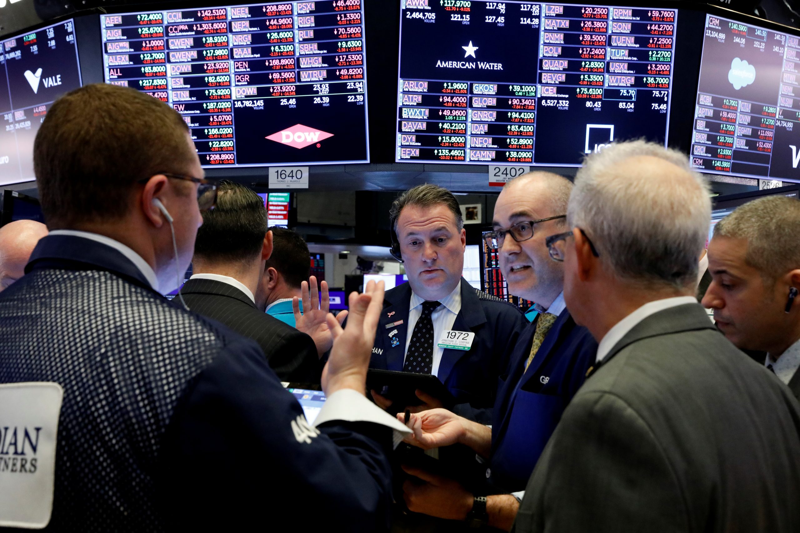Traders work on the floor of the New York Stock Exchange (NYSE) near the close of trading in New York