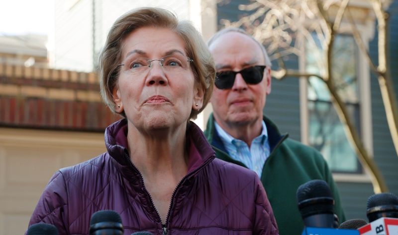 Senator Elizabeth Warren talks to reporters after telling her staff she is withdrawing from 2020 U.S. presidential race outside her home in Cambridge, Massachusetts