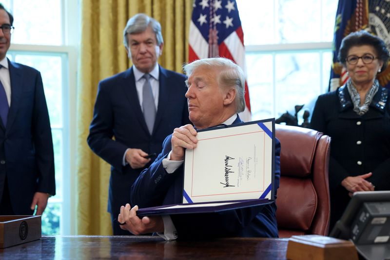 U.S. President Trump participates in coronavirus relief bill signing ceremony at the White House in Washington