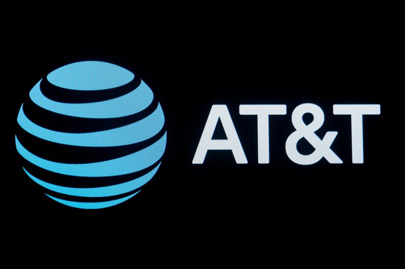 FILE PHOTO: FILE PHOTO: The company logo for AT&T is displayed at the NYSE in New York