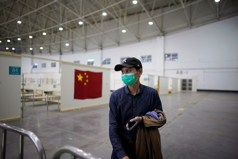Staff member is seen a convention center that was used as a makeshift hospital in Wuhan