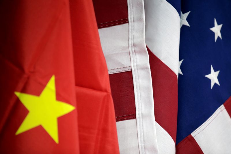 FILE PHOTO: Flags of U.S. and China are displayed at AICC's booth during China International Fair for Trade in Services in Beijing