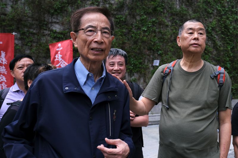FILE PHOTO: Hong Kong politician Martin Lee and Founder of Next Media Jimmy Lai march during a protest to demand authorities scrap a proposed extradition bill with China, in Hong Kong