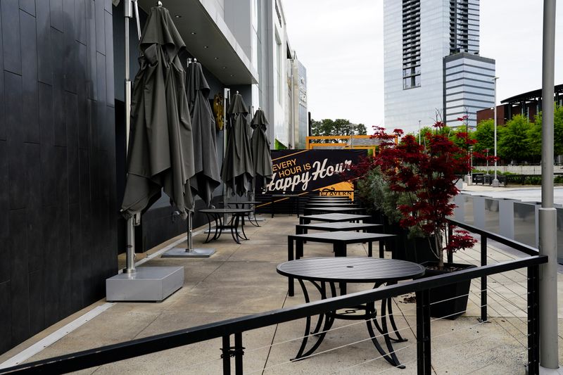 FILE PHOTO: An empty patio is seen outside a closed restaurant days days before the phased reopening of businesses from coronavirus disease rules in Atlanta