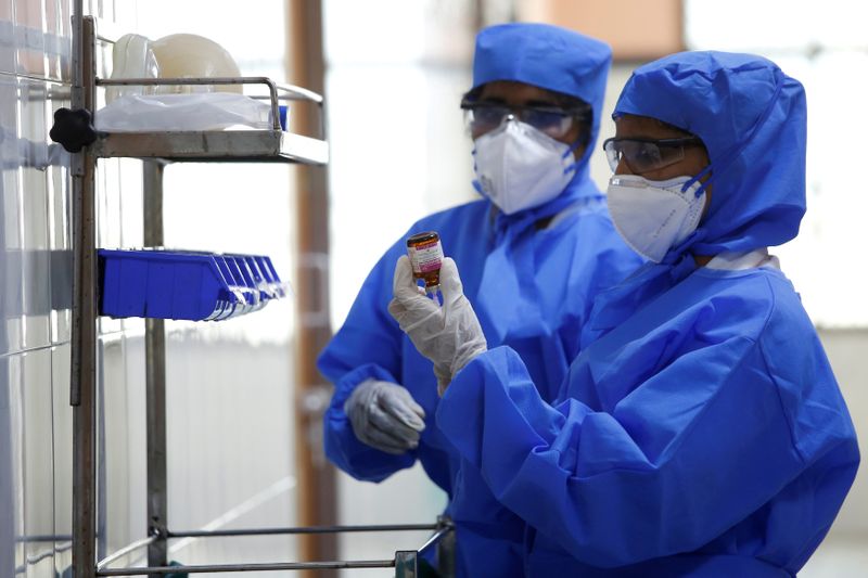 FILE PHOTO: Medical staff with protective clothing are seen inside a ward specialised in receiving any person who may have been infected with coronavirus, at the Rajiv Ghandhi Government General hospital in Chennai