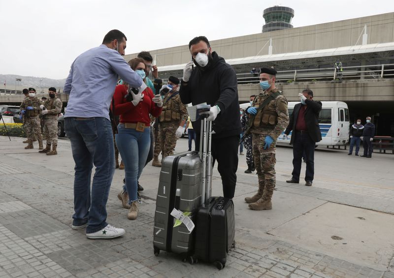A Lebanese, who was stranded abroad by coronavirus lockdowns, arrives at Beirut's international airport
