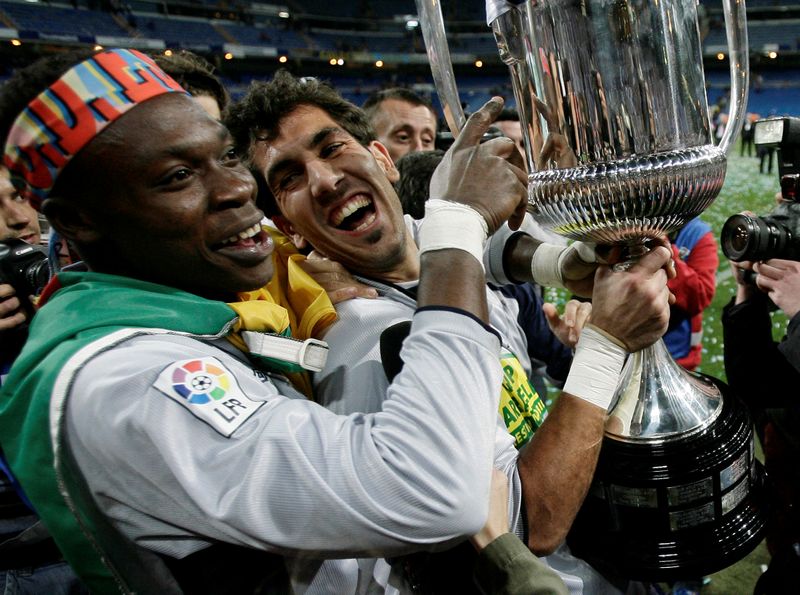 FILE PHOTO: Espanyol's goalkeepers celebrate victory over Real Zaragoza after their King's Cup final soccer match in Madrid