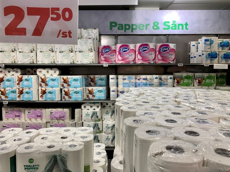 Toilet paper rolls fill the shelves at a store in Stockholm