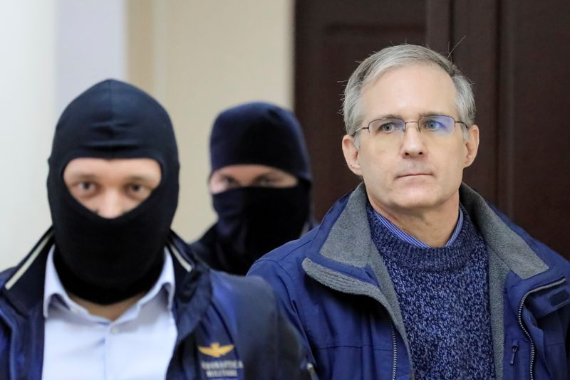 FILE PHOTO: Former U.S. Marine Paul Whelan, who was detained and accused of espionage, is escorted inside a court building in Moscow