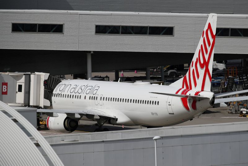 A Virgin Australia plane at Kingsford Smith International Airport after Australia implemented an entry ban on non-citizens and non-residents due to the coronavirus outbreak