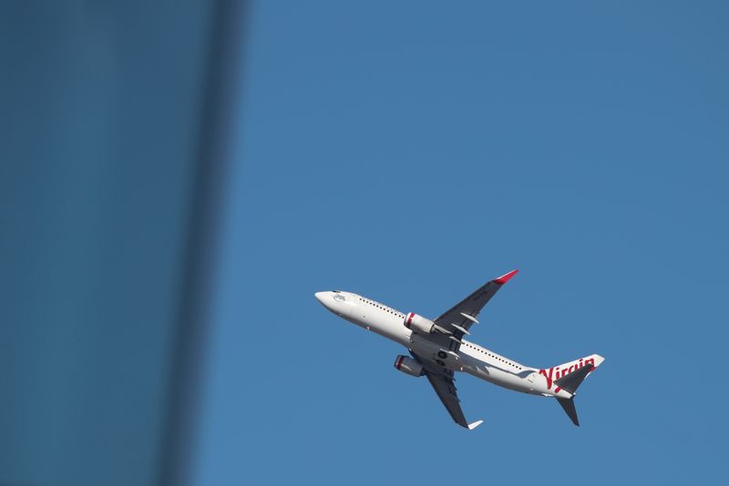 A Virgin Australia Airlines plane takes off from Kingsford Smith International Airport in Sydney