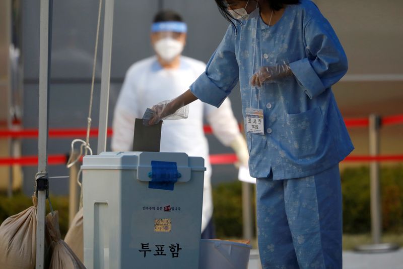 FILE PHOTO: South Korean coronavirus patients cast their ballots parliamentary election at a polling station set up at a quarantine center in Yongin
