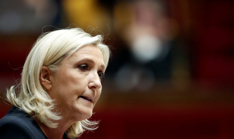 FILE PHOTO: Marine Le Pen, member of parliament and leader of French far-right National Rally (Rassemblement National) party, delivers a speech during a debate on migration at the National Assembly in Paris