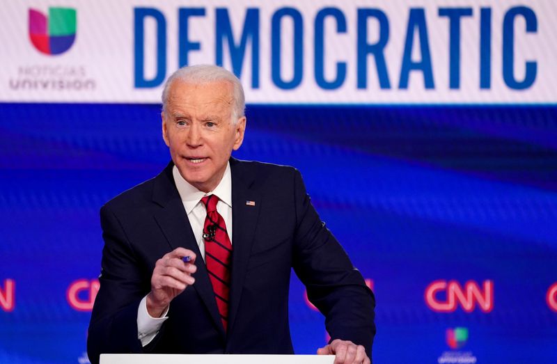 FILE PHOTO: Democratic U.S. presidential candidate and former Vice President Joe Biden speaks at the 11th Democratic candidates debate of the 2020 U.S. presidential campaign in Washington