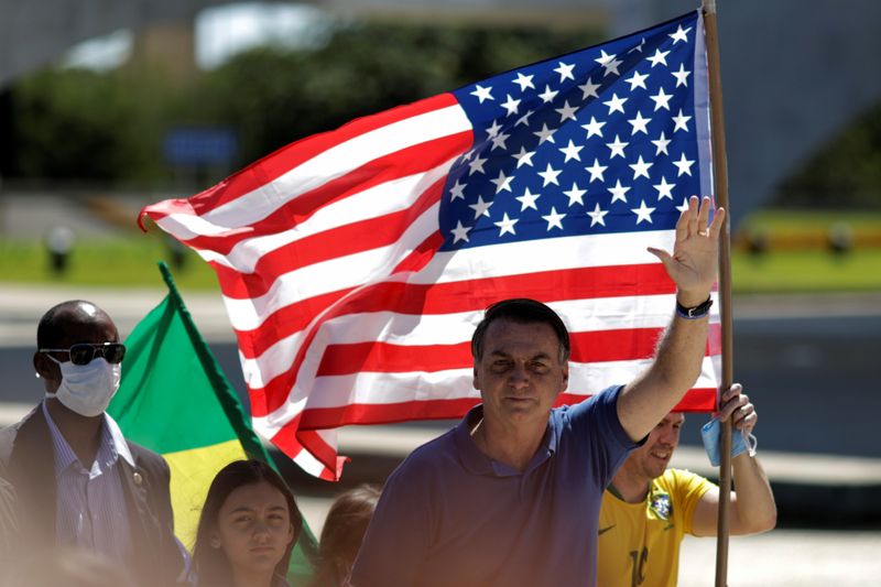 Brazil's President Jair Bolsonaro greets supporters during a protest, in Brasilia