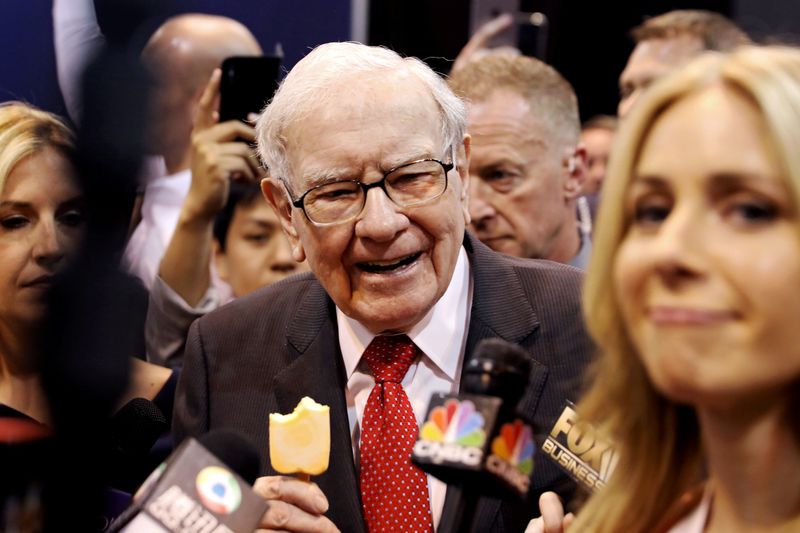 FILE PHOTO: Berkshire Hathaway Chairman Warren Buffett walks through the exhibit hall as shareholders gather to hear from the billionaire investor at Berkshire Hathaway Inc's annual shareholder meeting in Omaha