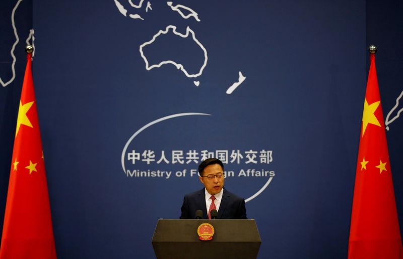 FILE PHOTO: Chinese Foreign Ministry spokesman Zhao Lijian attends a news conference in Beijing