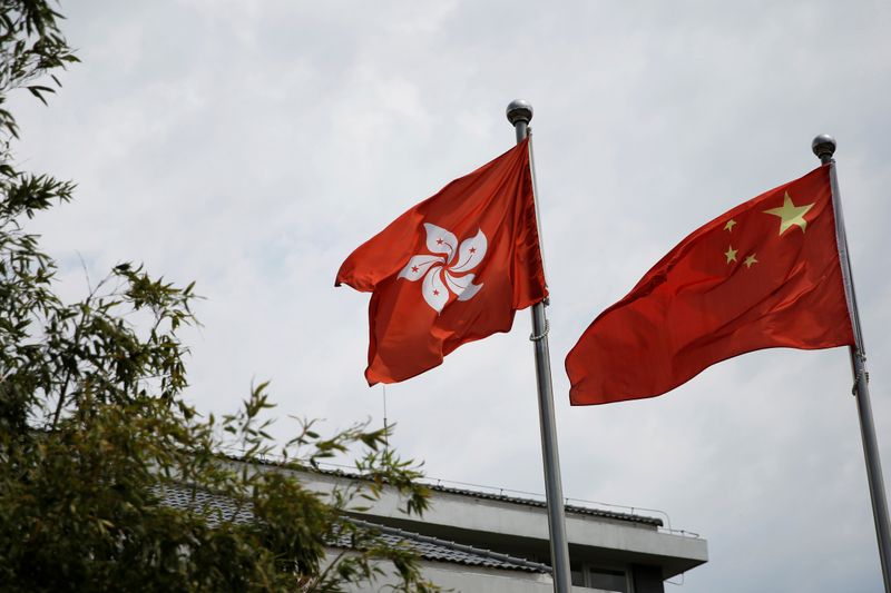Chinese and Hong Kong flags flutter in Beijing