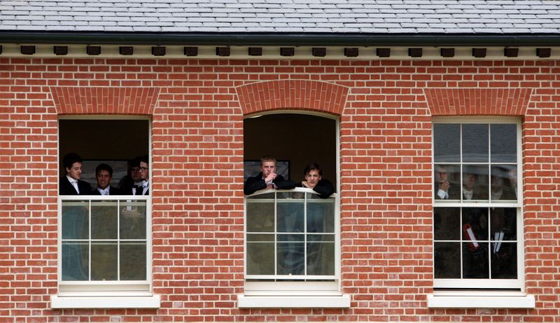 FILE PHOTO: Pupils watch during the visit by Britain's Prince Charles to open the new Bekynton Field Development building at Eton College near Windsor