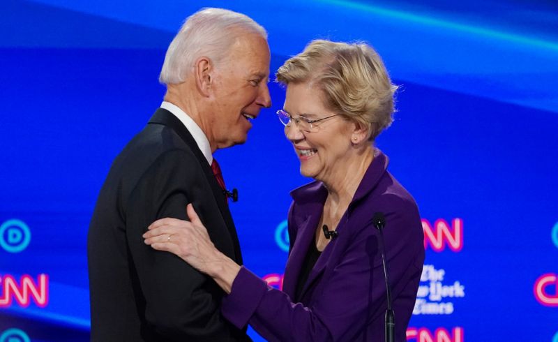 FILE PHOTO: Democratic presidential candidate and former Vice President Biden shakes hands with Senator Warren in Westerville